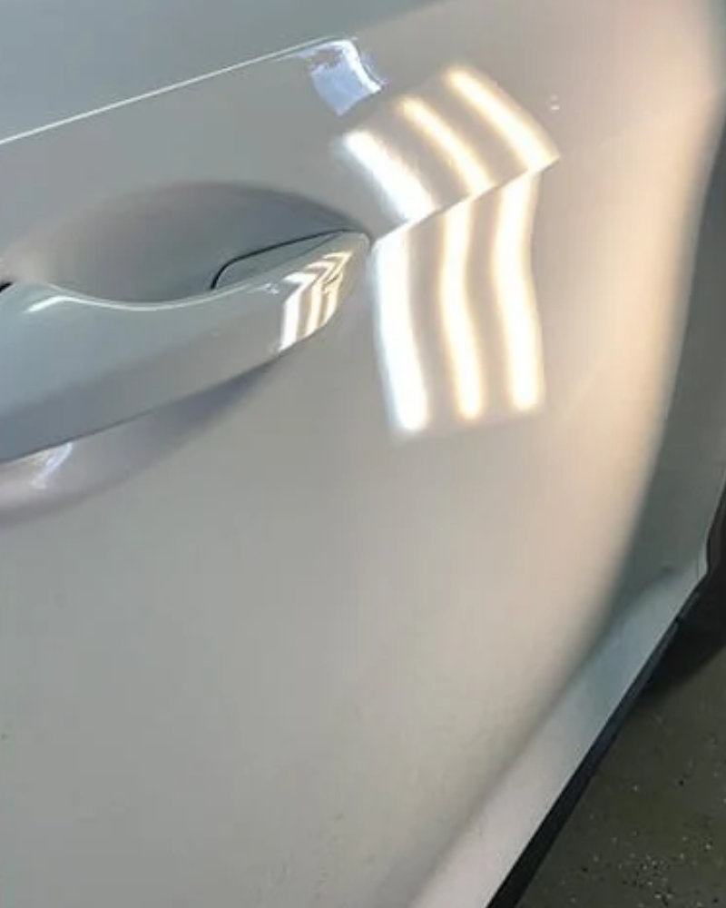 After: Roof dent repair without repainting